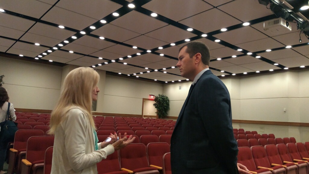 Andrew Brisbo speaks to a medical marijuana patient at the MRA meeting