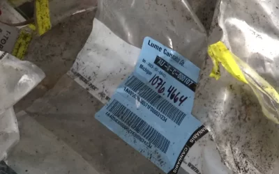 Apparent cannabis testing bags in trash pile in Lansing